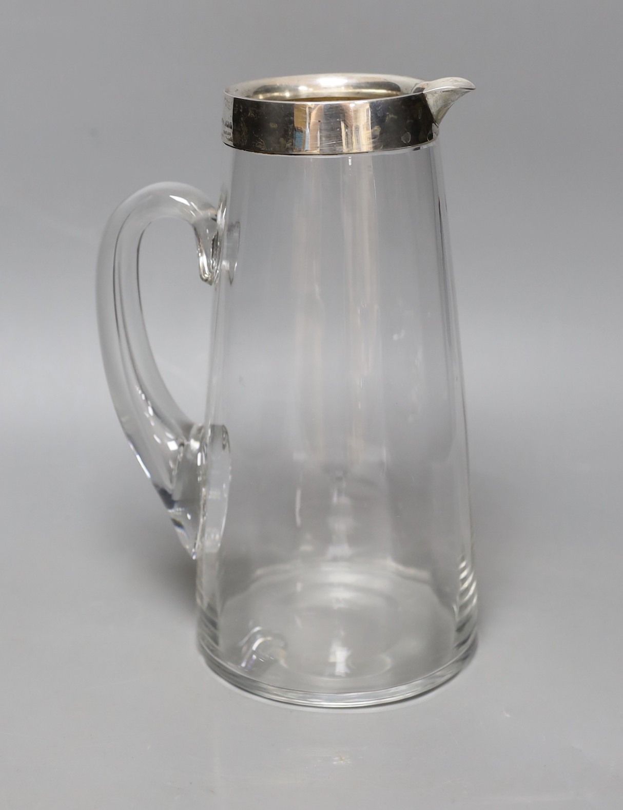 An early 20th century Asprey silver mounted glass jug. 24.5cm tall